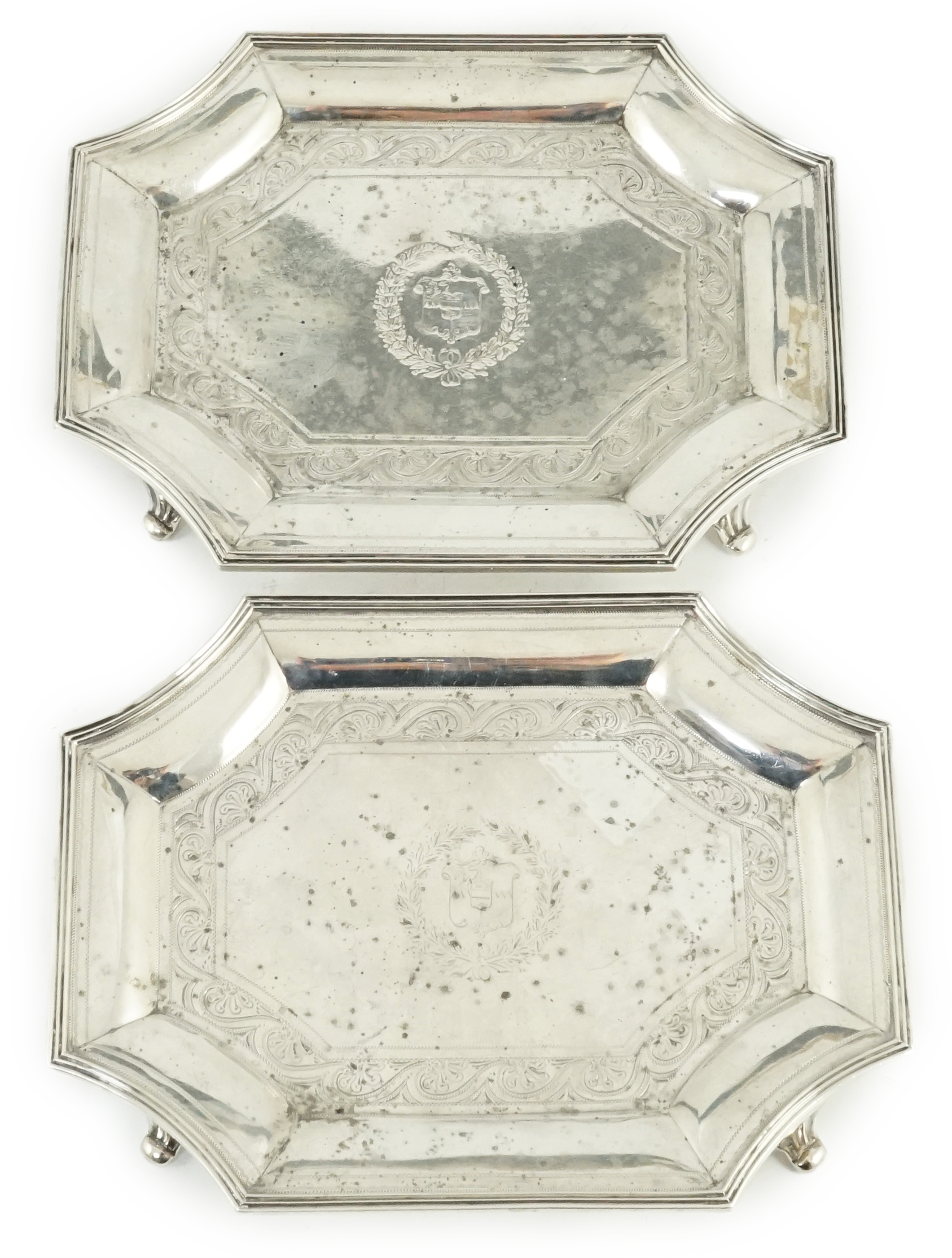 A pair of late Victorian engraved silver teapot stands, by Hunt & Roskell (ex Storr & Mortimer)